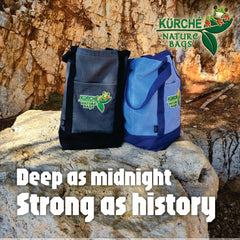 Kürché Nature Bags brand story beach scene featuring Midnight Black tote with bold “Deep as midnight, Strong as history” text